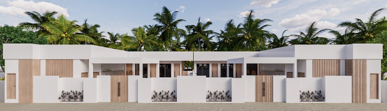 Beachfront elevation of the guest house among the palms