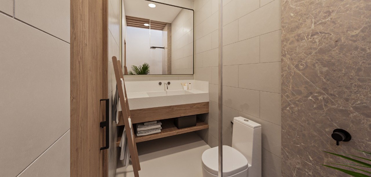 En-suite bathroom with vanity and marble